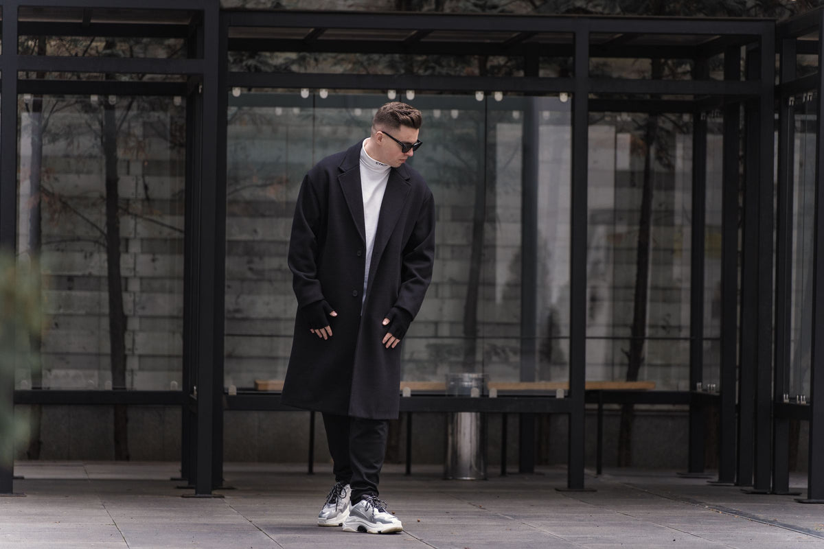 Man in long black coat