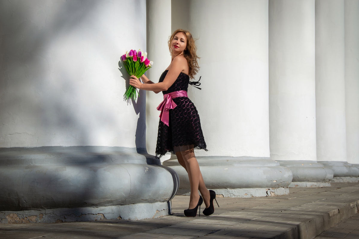 Woman in black dress and high heels